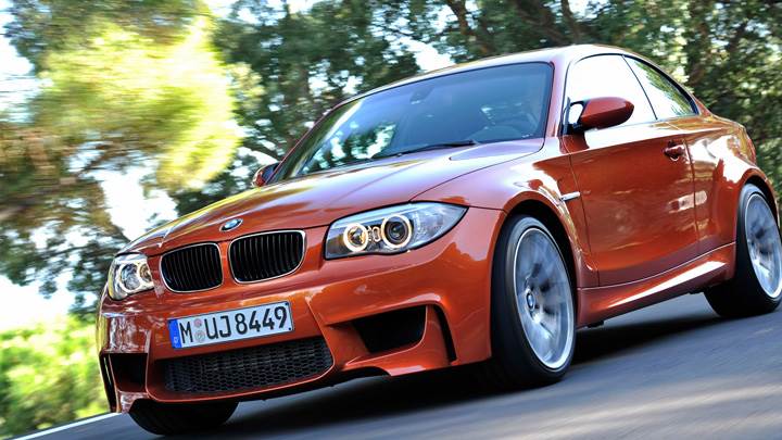 2011 BMW 1 Series M Running on Road in Orange
